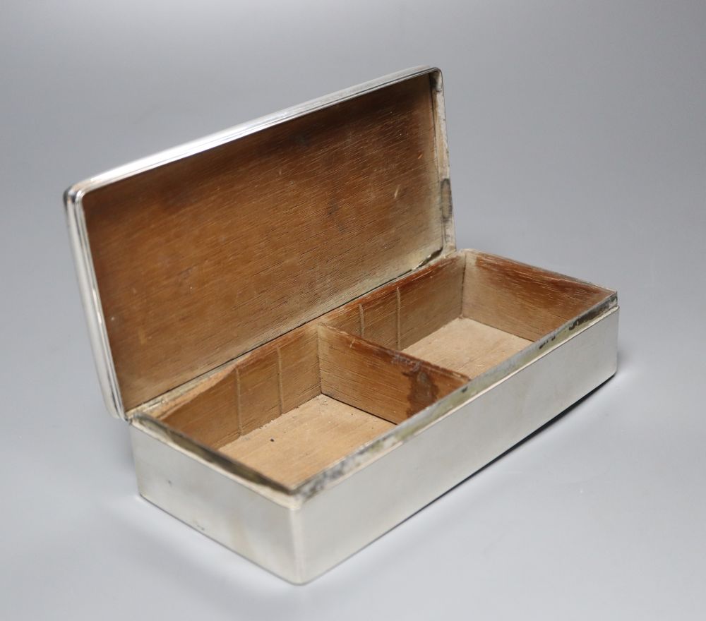 A continental white metal mounted rectangular cigarette box, with pierced engraved lid, 18.6cm, gross 17.5oz.